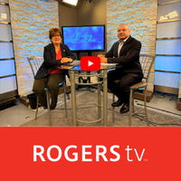 Mayor and project manager sitting at a table with words ROGERSTV Below on a red box