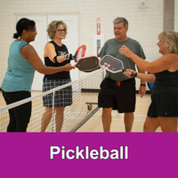 Residents playing pickleball.