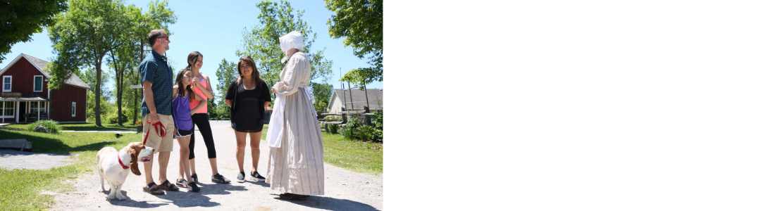 family with dog talking to lady in period dress