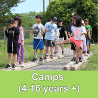 groups of kids holding ropes standing on wood with green banner with words Camps (4-16 years+)