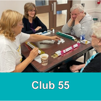 4 older adults playing mahjong around a table with aqua bar and text Club 55