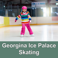 Child in winter clothing and a helmet skating on an indoor skating rink