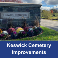 Stone sign with words Keswick Cemetery and flower bed in front with blue bar and words Keswick Cemetery Improvements