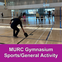 Adult playing Pickleball with another adult and a few children in a gymnasium