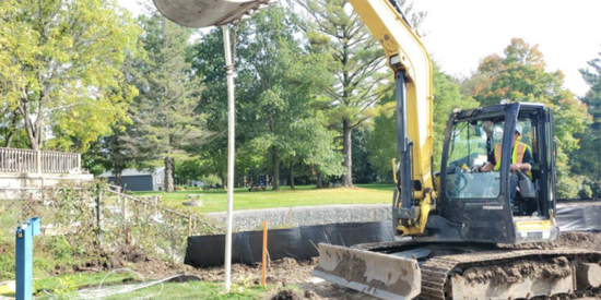 backhoe moving dirt