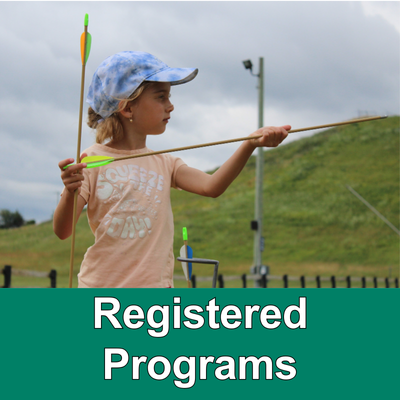 Child holding arrows with green bar with text Registered activities