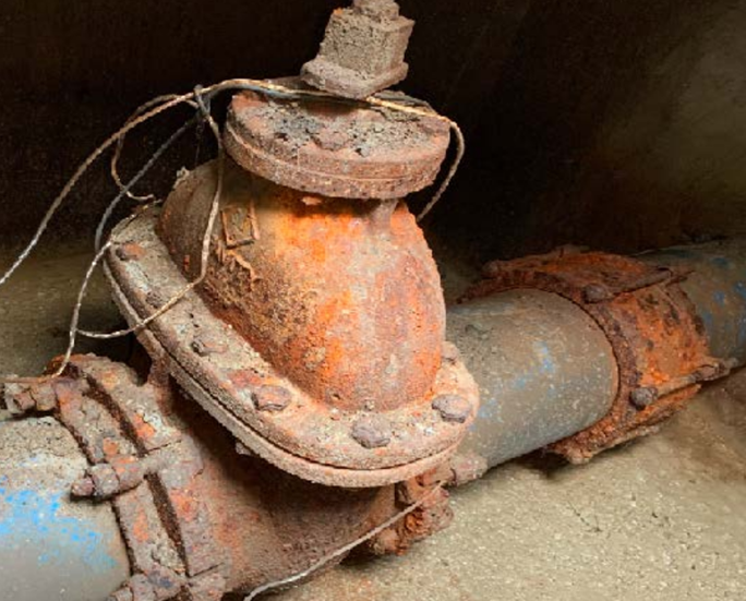 a rusted pile and valve chamber