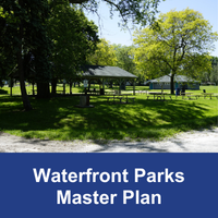 green park area with picnic structures and tables and blue banner with text Waterfront Parks Master Plan