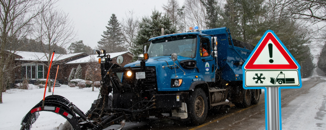 blue snow plow on a street